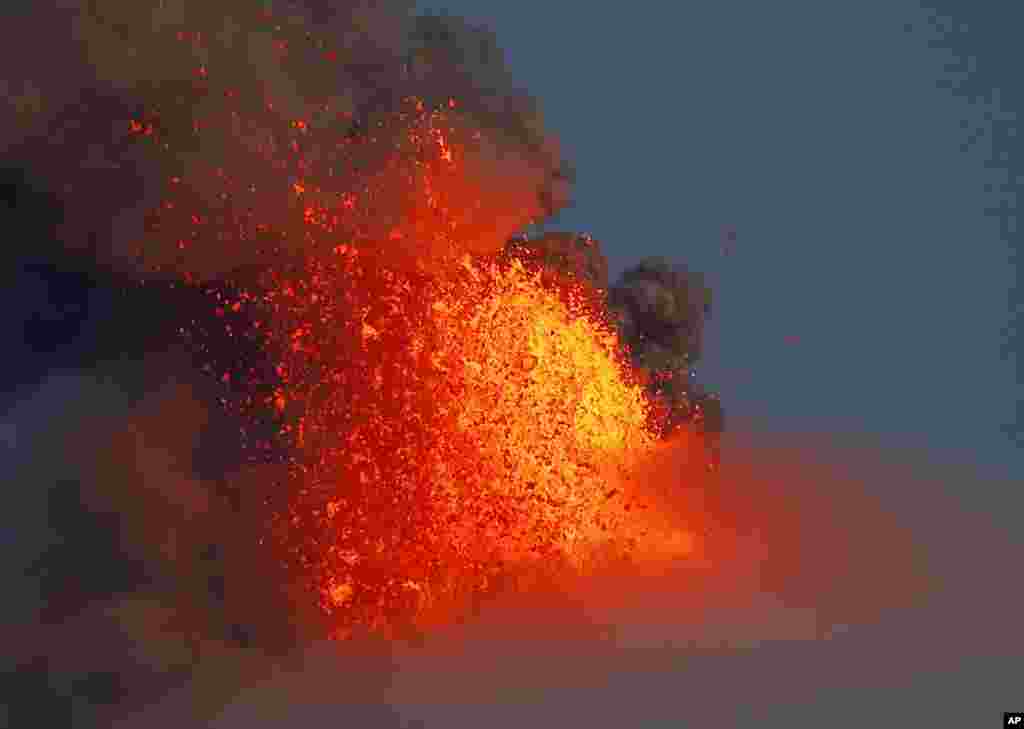 Mayon volcano spews red-hot lava in another eruption, as seen from Legazpi city, Albay province, about 340 kilometers (200 miles) southeast of Manila, Philippines.