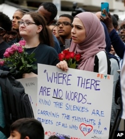 Mourners listen to speakers June 21, 2017, in Reston, Va., during a vigil in honor of Nabra Hassanen. Islamic leaders say the beating death of Nabar looks all too much like a hate crime.