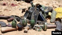 Ammunition used by suspected al Shabaab assailants killed during an attack is displayed outside Somalia's regional government headquarters in the central city of Baidoa, March 12, 2015. 