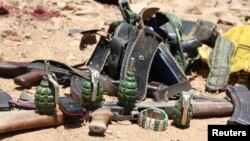 FILE - Ammunition used by suspected al-Shabab assailants killed during an attack is displayed outside Somalia's regional government headquarters in the central city of Baidoa, March 12, 2015. 