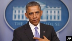 FILE - President Barack Obama speaks in the Brady Press Briefing Room of the White House, Nov. 14, 2013.