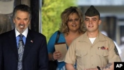 Marine Corps Sgt. Frank D. Wuterich arrives for a pre-trial hearing with his lawyer Neal A. Puckett and girlfriend Melissa Balcombe at Camp Pendleton, California March 22, 2010.
