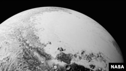 This synthetic perspective view of Pluto, based on the latest high-resolution images to be downlinked from NASA’s New Horizons spacecraft, shows what you would see if you were approximately 1,100 miles (1,800 kilometers) above Pluto’s equatorial area, loo