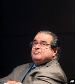 In this Oct. 18, 2011 file photo, U.S. Supreme Court justice Antonin Scalia looks into the balcony before addressing the Chicago-Kent College Law justice in Chicago.