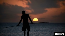 FILE - An Aboriginee is seen spear fishing in Australia's Northern Territory.