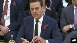 News Corp. executive James Murdoch speaks during his second appearance before British parliamentarians investigating the country's phone hacking scandal in London, November 10, 2011.