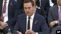 News Corp. executive James Murdoch speaks during his second appearance before British parliamentarians investigating the country's phone hacking scandal in London, November 10, 2011.