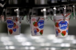 A robotic arm sorts yogurts at a distribution centre near Prague, Czech Republic, February 17, 2020. Picture taken February 17, 2020.