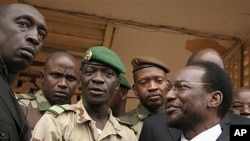 Mali's parliamentary head Dioncounda Traore, right, with coup leader Amadou Haya Sanogo, center, Kati, April 9, 2012.