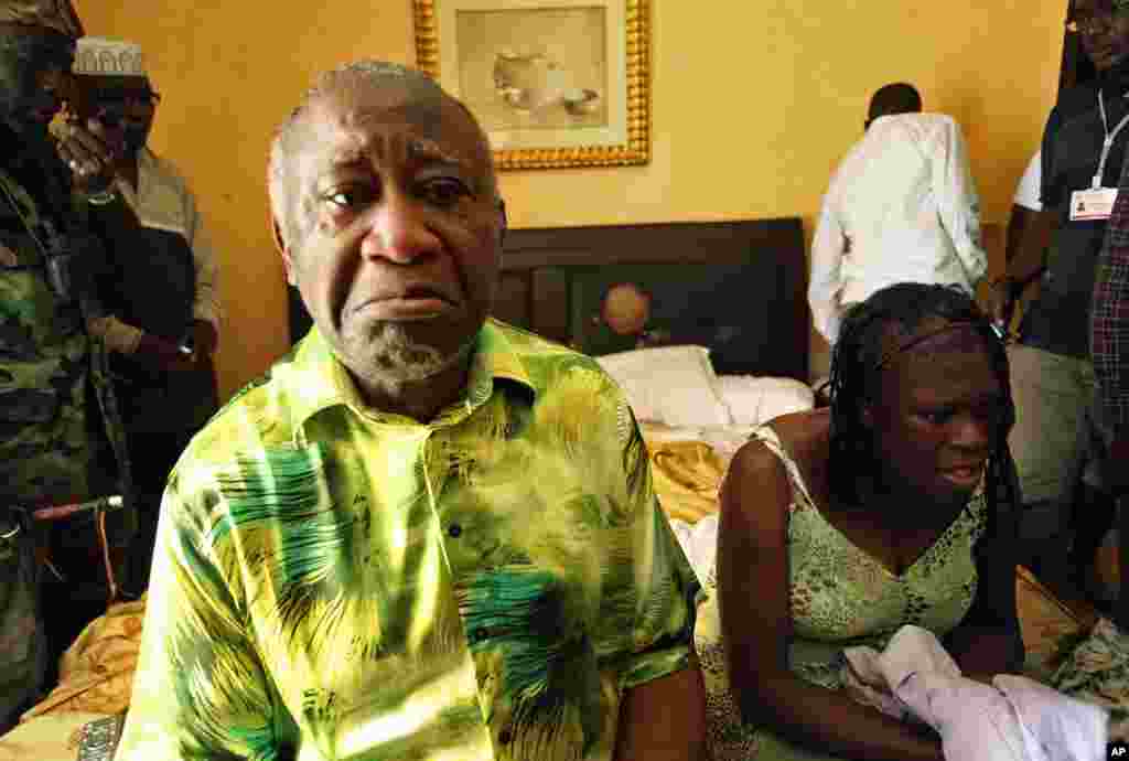 Ivory Coast President Laurent Gbagbo and his wife, Simone, in a room at Hotel Golf in Abidjan after they were arrested, April 11, 2011. (Reuters)