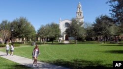 In this Tuesday, Jan. 28, 2020 photo, students are seen on campus at Rollins College in Winter Park, Fla. Because of privacy law, university administrators won't be able to disclose students' sex, race or Hispanic origin on the 2020 Census. (AP Photo/John Raoux)