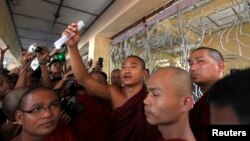 FILE - Gambira talks to supporters at the court hearing of Pyi Nyar Thiha, the head of Shwenyawar monastery, in this January 2012 photo.