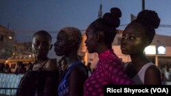 Models backstage before Dakar Fashion Week's 'Street Parade' show, June 29, 2017.