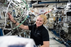 NASA astronaut and Expedition 64 Flight Engineer Kate Rubins works on research hardware inside the JAXA (Japan Aerospace Exploration Agency) Kibo laboratory module. (Photo courtesy of NASA)