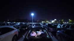 Norman Butler, a first time food bank user, and his girlfriend Cheryl Butler wait overnight in their car, along with others lined up to receive food at a distribution point in Metairie, La. (AP Photo/Gerald Herbert)