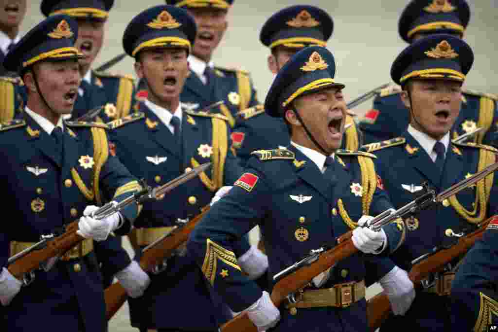 Members of a Chinese honor guard march during a welcome ceremony for Serbian President Tomislav Nikolic at the Great Hall of the People in Beijing.