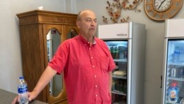 Mike Frank, owner of Clifford Street Cleaners, at his business in Detroit, September 2, 2021. (AP Photo/Mike Householder)