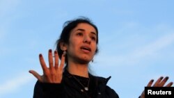 FILE - Nobel Peace Prize laureate and Yazidi activist Nadia Murad gestures while speaking during a visit to Sinjar, Iraq, Dec. 14, 2018.