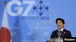 Japan's Prime Minister Shinzo Abe holds a news conference at the end of the G7 summit at the European Council headquarters in Brussels, June 5, 2014.