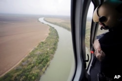 FILE - U.S. Customs and Border Protection Air and Marine agents patrol along the Rio Grande on the Texas-Mexico border near Rio Grande City, Texas, Feb. 24, 2015.