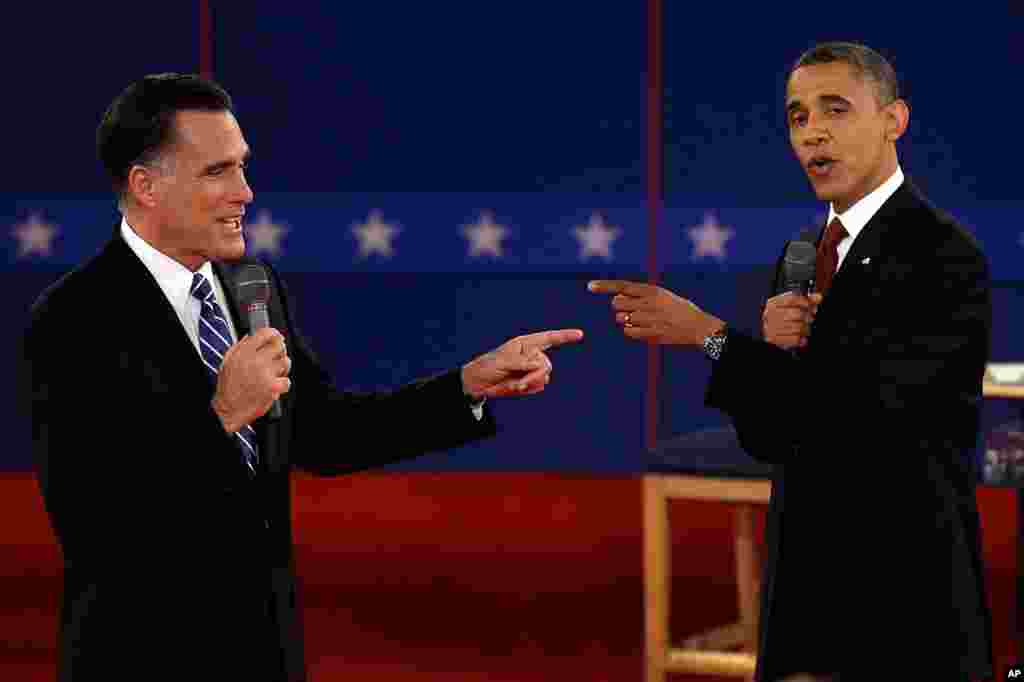 October 16: Republican presidential nominee Mitt Romney, left, and President Barack Obama spar during the second presidential debate, Hofstra University in Hempstead, New York.