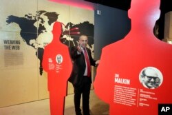 Avner Avraham, former Israeli Mossad agent and curator of "Operation Finale: The Capture & Trial of Adolf Eichmann," stands among silhouette cutouts of the 11 agents who caught Eichmann in Argentina, in the exhibit at the Museum of Jewish Heritage, in New York, July 14, 2017.