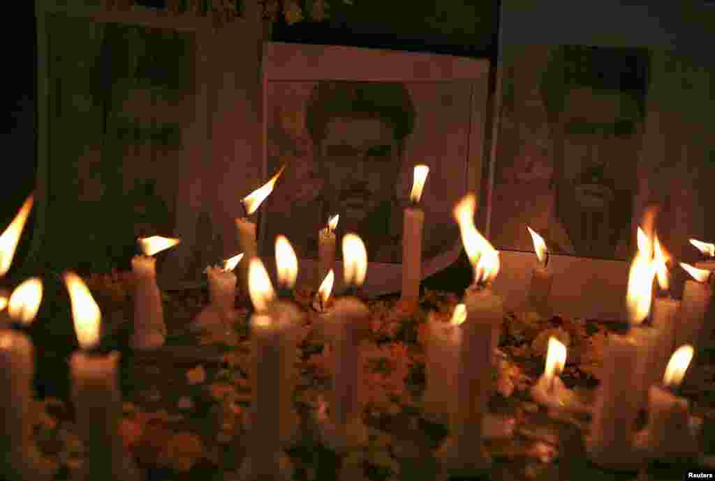 Candles are placed in front of the posters of Sarabjit Singh, who was convicted of spying for India and sentenced to death in Pakistan, in the northern Indian city of Amritsar May 2, 2013.