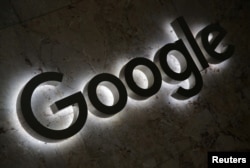 FILE - A Google logo is displayed at the entrance to the internet based company's offices in Toronto, Ontario, Sept. 9, 2018.