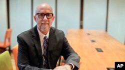 Former Army criminal investigator Russell Strand poses for a photo in New York, Jan. 24, 2018.