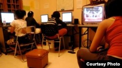 An image from the dorm where female students were studying and watching TV in their library room at the dorm. (Photo: Anne E. Moore)