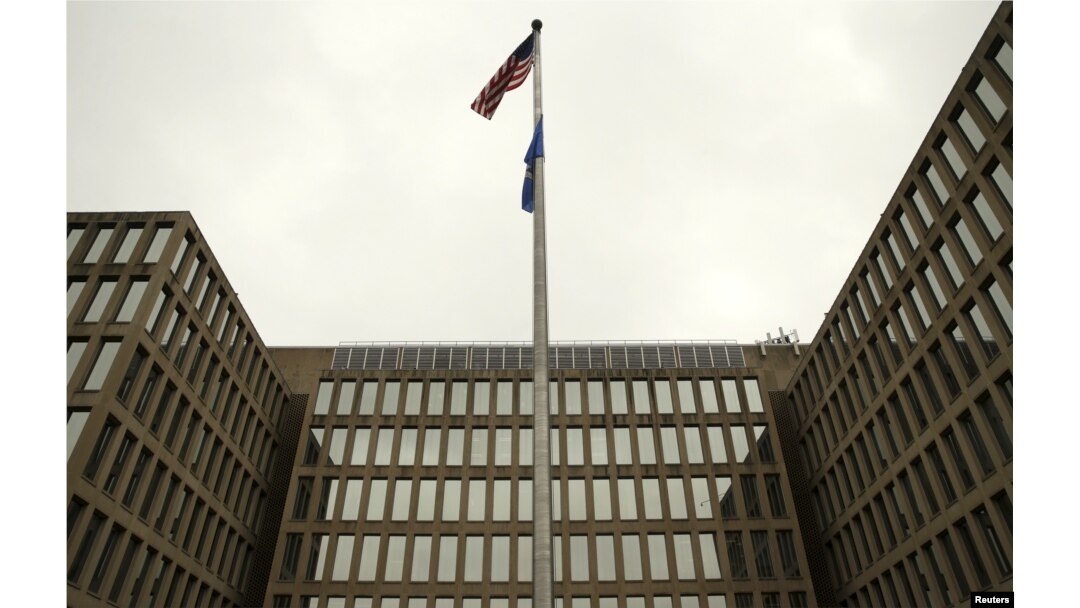 The U.S. national flag is pictured at the Office of Personnel Management building in Washington, June 5, 2015.
