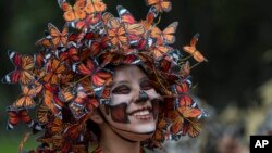 A performer participates in the Day of the Dead parade on Reforma avenue in Mexico City, Oct. 27, 2018.