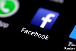 FILE: The Facebook application is seen on a phone screen Aug. 3, 2017.