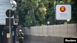 FILE - A military policeman patrols outside the Association of Southeast Asian Nations (ASEAN) secretariat building, before the ASEAN leaders' meeting in Jakarta, Indonesia, April 24, 2021. 