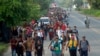 About 1,000 Migrants Cross Into Mexico, Start Walking to US