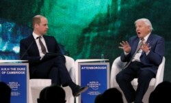 FILE - Britain's Prince William, Duke of Cambridge interviews naturalist Sir David Attenborough during the World Economic Forum (WEF) annual meeting in Davos, Switzerland, Jan. 22, 2019.