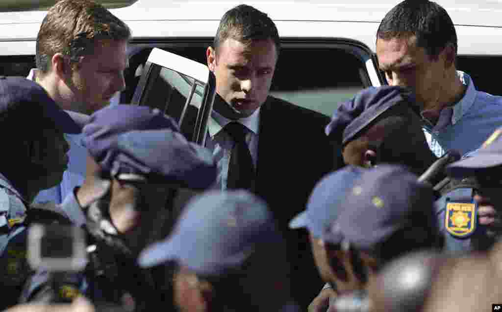 Oscar Pistorius, arrives outside the court in Pretoria, South Africa, Tuesday, Oct. 21, 2014.