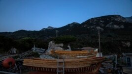Wooden boats at Agios Isidoros boat building area on the eastern Aegean island of Samos, Greece, on Wednesday, June 9, 2021. (AP Photo/Petros Giannakouris)
