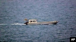 A photo provided by the U.S. Navy shows a small vessel that was fired upon by the U.S. Navy off Dubai's coast on Monday, July 16, 2012. 