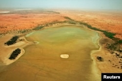 An aerial view of the dried up Lake Banzena in the drought-stricken Gourma region of Mali, May 24, 2009.