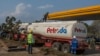 FILE - A tanker offloads fuel at a Petroda filling station in Lilongwe, Malawi, October 1, 2021. A trainload of diesel fuel arrived July 23, 2024, in Malawi for the first time in 21 years, signaling the end of shortages. 