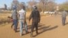 Police arresting some political activists. (Courtesy photo: Zimbabwe Lawyers for Human Rights)