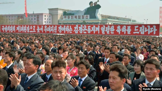 FILE - North Koreans clap during a rally at the Kim Il Sung Square in Pyongyang, April 10, 2014. North Korea held the rally to celebrate the re-election of its leader Kim Jong Un as First Chairman of the ruling National Defense Commission.