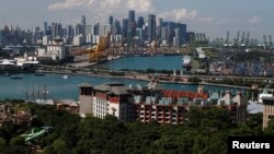 A view of Sentosa island and the skyline of the central business district in Singapore, June 4, 2018.