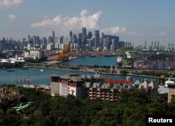 A view of Sentosa island and the skyline of the central business district in Singapore, June 4, 2018.