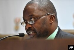 South Africa's minister of justice and correctional services, Michael Masutha, speaks to the press in Pretoria, South Africa, Oct. 21, 2016. Masutha said South Africa will soon seek to withdraw from the International Criminal Court.