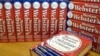 FILE - Merriam-Webster's Collegiate Dictionary are seen at the company's headquarters office in Springfield, Mass.,