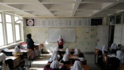 Hadia, 10, a 4th grade primary school student attends a class in Kabul, Afghanistan, Oct. 26, 2021.