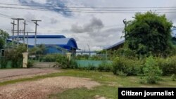 ບໍລິເວນດ້ານຫລັງ ຂອງບໍລິສັດພີເອສ