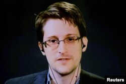 FILE - American whistleblower Edward Snowden delivers remarks via video link in February 2016.